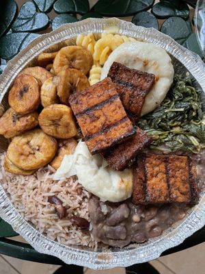Plantains, mac n cheese, dumplings, jerk tofu, sautéed greens, nine bean stew, rice and peas at Ninth Square Market Caribbean Style in New Haven