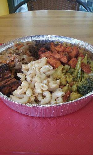 Mac n' chz, curry cauliflower and broccoli, smoky sweet potatoes, curried chickpeas, jerk tofu, cabbage and chick'n, and seitan stew at Ninth Square Market Caribbean Style in New Haven