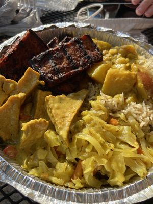 Jerk tofu, curried potatoes, seasoned rice, cabbage and curry tofu. at Ninth Square Market Caribbean Style in New Haven