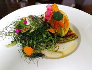 Wild herb salad with filled zucchini blossom and grilled peppers at Farbenfroh in Essen