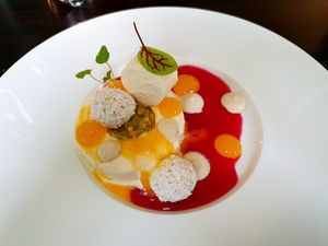 Passion fruit parfait
with white chocolate ganache, rice and coconut balls and currants at Farbenfroh in Essen