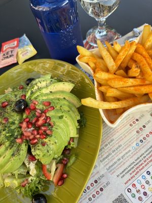 Avocado salad + fries (paprika on top)  at El Rincon de Beirut in Sevilla