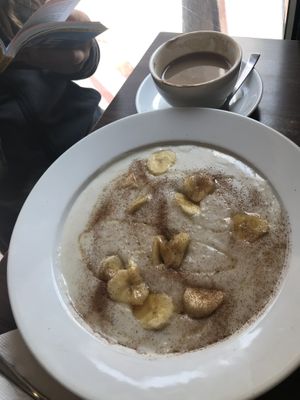 Porridge and cappuccino   at French Bakery in Kathmandu
