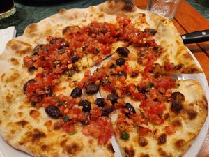 Focaccia pizza with black olives at Molino Pizzeria Ristorante in Montreux