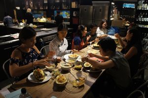After making all the raw vegan dishes, everyone sits down together to enjoy the food. at Raw Vegan Workshop - Eating Thai & Spice of India in Kuala Lumpur