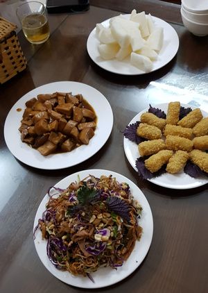 Banana flower salad, mushroom dish and deep fried bananas.  at Huong Sen in Ha Giang