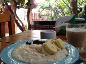chai tea and not so great banana oatmeal with the beautiful garden in the background at Blue Diamond in Chiang Mai