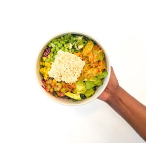 THE BWK CHOP SALAD: 
Thai Lime Vinaigrette, kale and cabbage, ABF spiced chicken, corn, scallions, edamame, tomato, avocado, rice crouton at Brightwok Kitchen - The Loop in Chicago