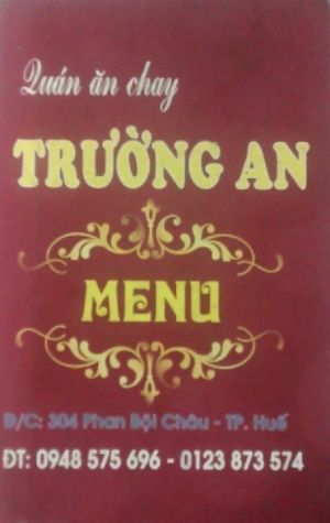 front of menu at Quán ăn chay Truong An in Hue