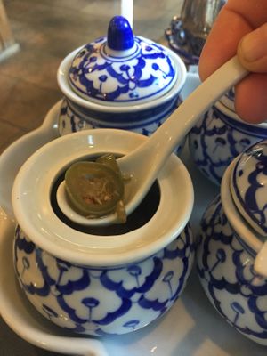 Spiced peppers in vinegar; comes in the hot sauce tray. A hint or spicey and vinegar. Not overpowering, and delicious!! at Sawasdee Thai Cuisine in Ventura