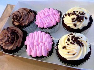 Chicken schnitzel and varietal of cupcakes :) at Las Vegan Cafe in Collingwood