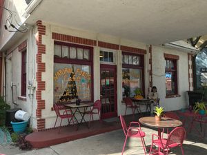 Nice covered area with tables and chairs outside. at Bambi's Country Farm Market in High Springs