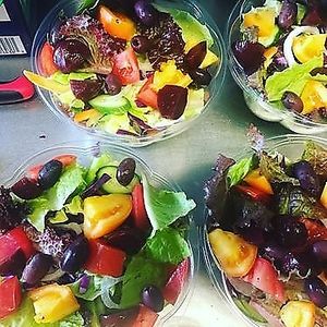 Farm Salad, mostly local lettuces, tomatoes, red & green cabbages, endive salad greens, euro mini-cucumbers, baby pickled beets, kalamata olives & Lemon Shallot Vinaigrette! at Bambi's Country Farm Market in High Springs