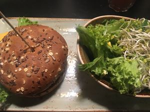 Vegan Feuermeister burger and salad  at MUC - Hans im Glück - T2 in Munich