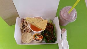 Takeaway taster plate with berry delicious smoothie. at The Accidental Vegan Cafe in Honiton