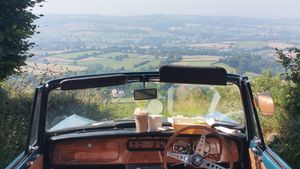 Enjoying the Devon Sunshine with a takeaway (Picnic) Taster Plate. East Hill Strips just outside Honiton, with views over Ottery St Mary and beyond towards the Moors. at The Accidental Vegan Cafe in Honiton