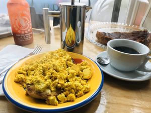 Scrambled Tofu on muffin...better size if you want a light bite 😋 at The Accidental Vegan Cafe in Honiton