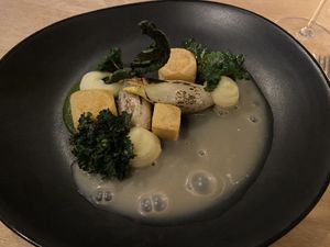Main course with polenta and chiqorice  at Morris and Bella in Amsterdam