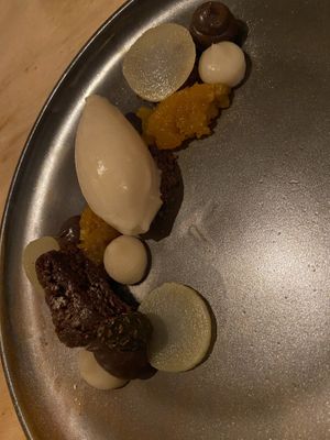 Dessert with parsnip ice-cream on coffee crumble, ‘suikerwortel’, choco spongecake and mousse.  at Morris and Bella in Amsterdam