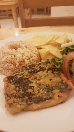 Main course--vegan fish, rice, salad, and potatoes  at Abdiel Vegan in Lima