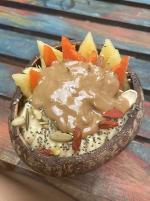Green goddess bowl with peanutbutter on top  at Raw Love - Downtown Tulum in Tulum