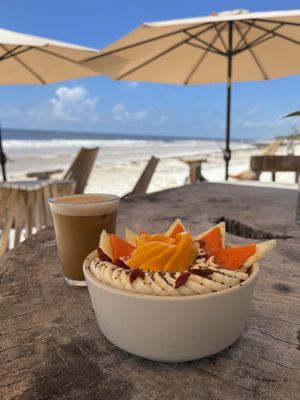 Passion fruit smoothie bowl, only outside seating on the beach  at Raw Love - Downtown Tulum in Tulum