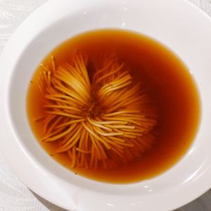 Sliced flower tofu in ginger soup at Tong De Veggie 同德素食 in Kowloon