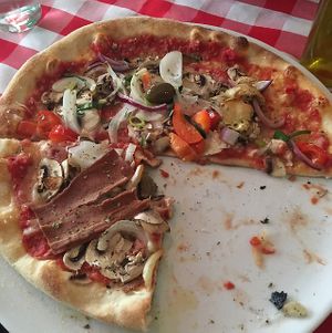 half  vegetable pizza with vegan cheese. at La Trattoria in Malmo