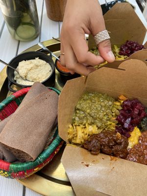 Mixed selection of curries lunch box  at Beza Ethiopian Food in South East London