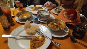 Chola Bhatura with naan bread on the right. Lentils curry and rice on the left at Buena Vista Curry Club in Havana