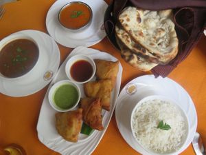 Naan bread, rice, curries and veggie samosas. at Buena Vista Curry Club in Havana