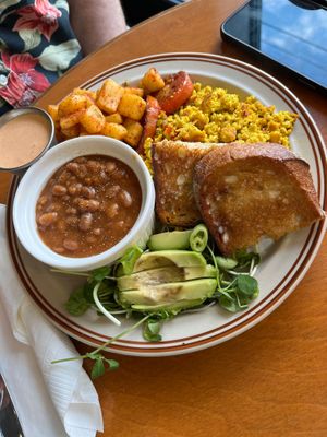 Breakfast plate with beans, scrambled tofu, toast, seasoned potatoes avocado and salad  at Springhouse in Halifax