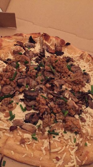 vegan pizza with mushrooms and tempeh  at Mellow Mushroom in Savannah