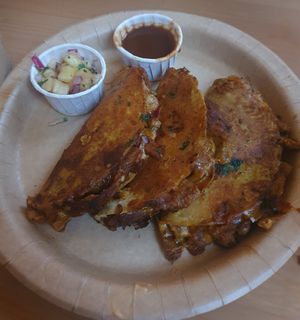 Birria: 3 corn tacos dipped & fried. Filled with ch*cken & mushroom, cheesy nacho sauce, onion & Jalapeño. Served with a pineapple salsa and Chipotle dip at GRUB in Manchester