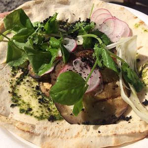 seasons eating aubergine flatbread at GRUB in Manchester