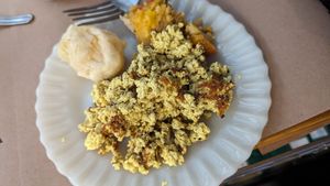 tofu mexido, pão de queijo e tortinha de frango vegetal at Padoca Vegan in Sao Paulo