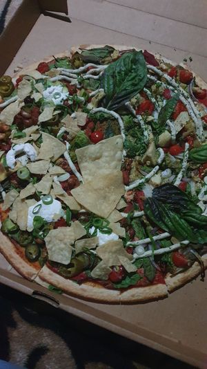 Half and half family size: nacho and pesto at Riptide Pizza in Woolgoolga