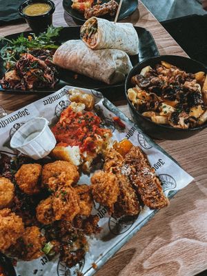Platter, chicken wrap & poutine (curry sauce in background) at Down the Hatch in Liverpool