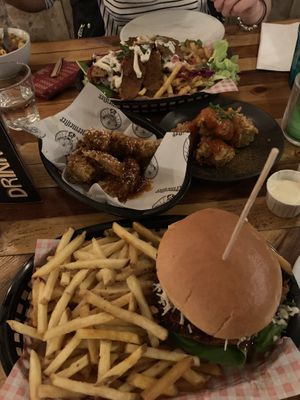 Burger and fries, donner fries, seitan wings with sweet chilli jäger glaze and jackfruit bites with buffalo sauce (little spicy)  at Down the Hatch in Liverpool