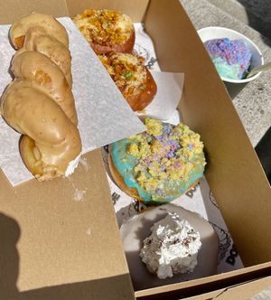 Cookie butter twist, bacon Mac and cheese, birthday cake, Portland fog and birthday cake ice cream with Cotton candy sprinkles  at Doe Donuts in Portland