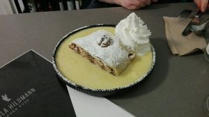 Vegan apple strudel with custard and cream at Attila Hildmann Organic Snackbar I in Berlin