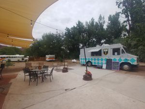 Outdoor space and the truck. Outdoor carpet is a foreign concept in Seattle or Houston... at Moab Kitchen in Moab