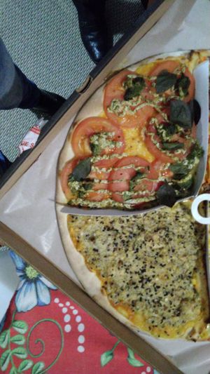 Pesto(not good) and bacon with alho poró (good) at Opte Pizzas in Curitiba