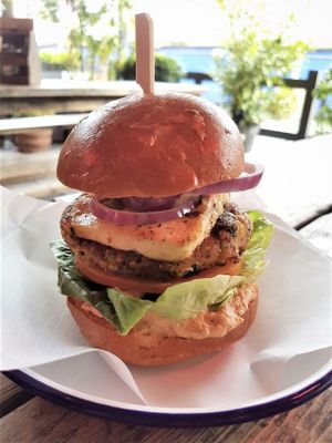 Quinoa Burger with broccoli, smashed chickpeas, Jack's smoked tomato houmous, in-house vegan halloumi, lettuce, olives and red onion at Jack's Bar in South East London