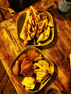 Vegan Hotdog and vegan nuggets with fries at Petite Sophie in Mahon