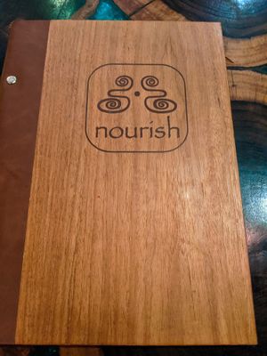 Front of menu for Atman Nourish Kafe (Dec-2019) at Atman Nourish Kafe in Ubud