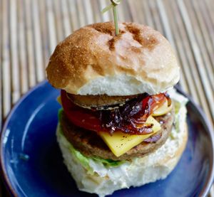 Haunt Classic- Seitan patty, smoked cheese, aubergine crisps, caramelised red onion, lettuce, tomato, gherkins, wholegrain mustard mayo at Haunt in North London