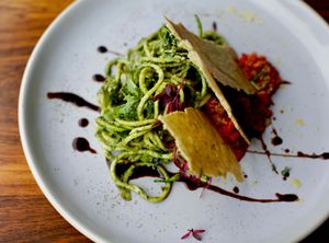 Raw courgetti with summer pesto, tomato & red pepper sauce, rocket, cashew nut cheese bread  at Haunt in North London