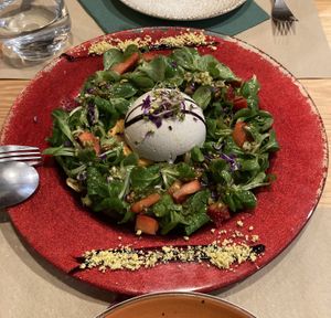 Burrata trufada sobre crema fría de tomate, cebolla caramelizada, canónigos y pesto   at Mapa Verde in San Sebastian