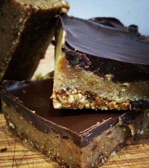 Vegan caramel slice - oat, almond, date base + cashew, tahini caramel filling and dark chocolate topping.

Available at the Saturday markets. at Shoots and Roots in Dublin